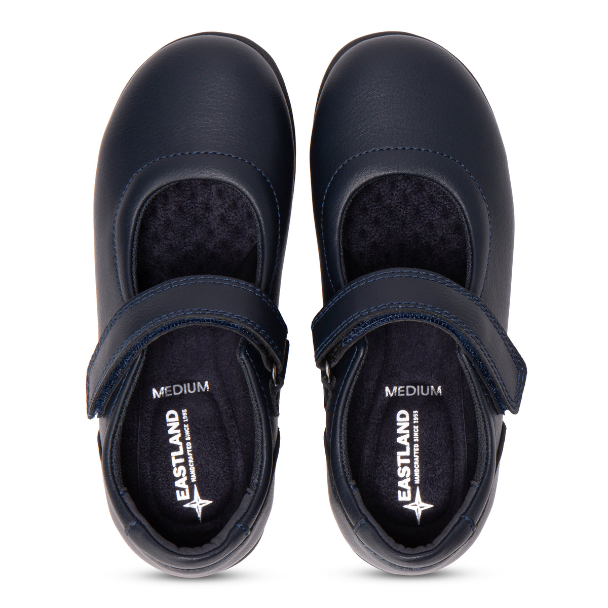 Kids' Harper navy Mary Jane shoes shown from a top-down view on a white background. Each shoe features a hook-and-loop strap closure and has the Eastland brand logo printed on the insole.